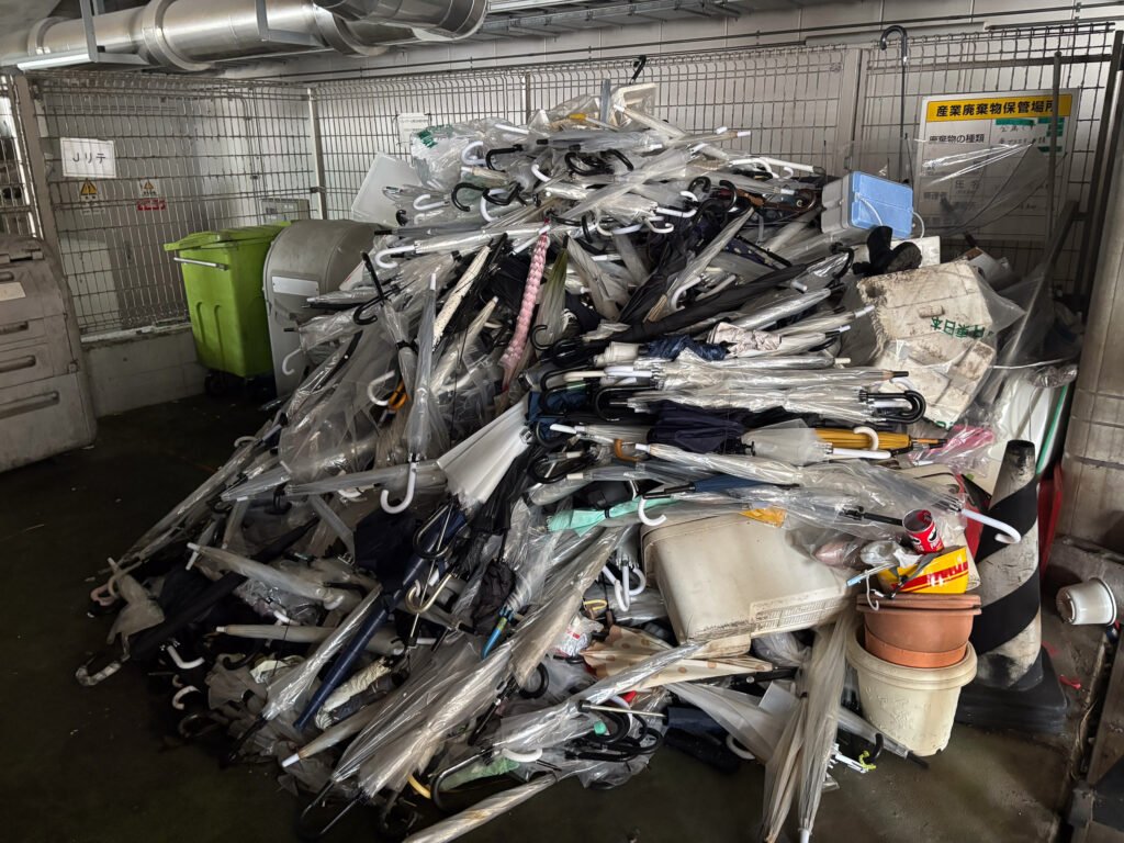 A large pile of old umbrellas at Urawa Station in Saitama City, Japan